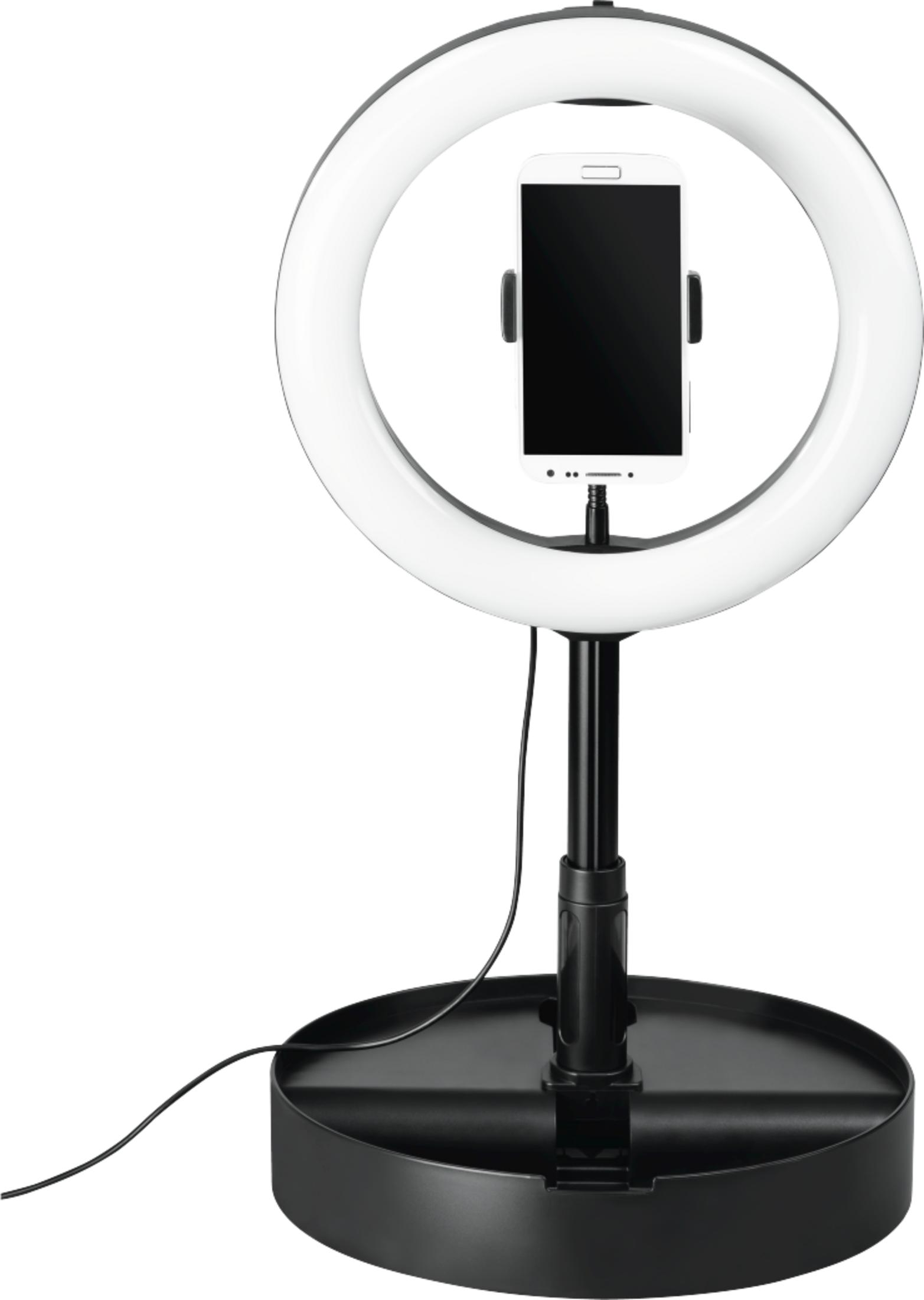Lampa pierścieniowa z telefonem komórkowym pośrodku stoi na czarnej podstawie.