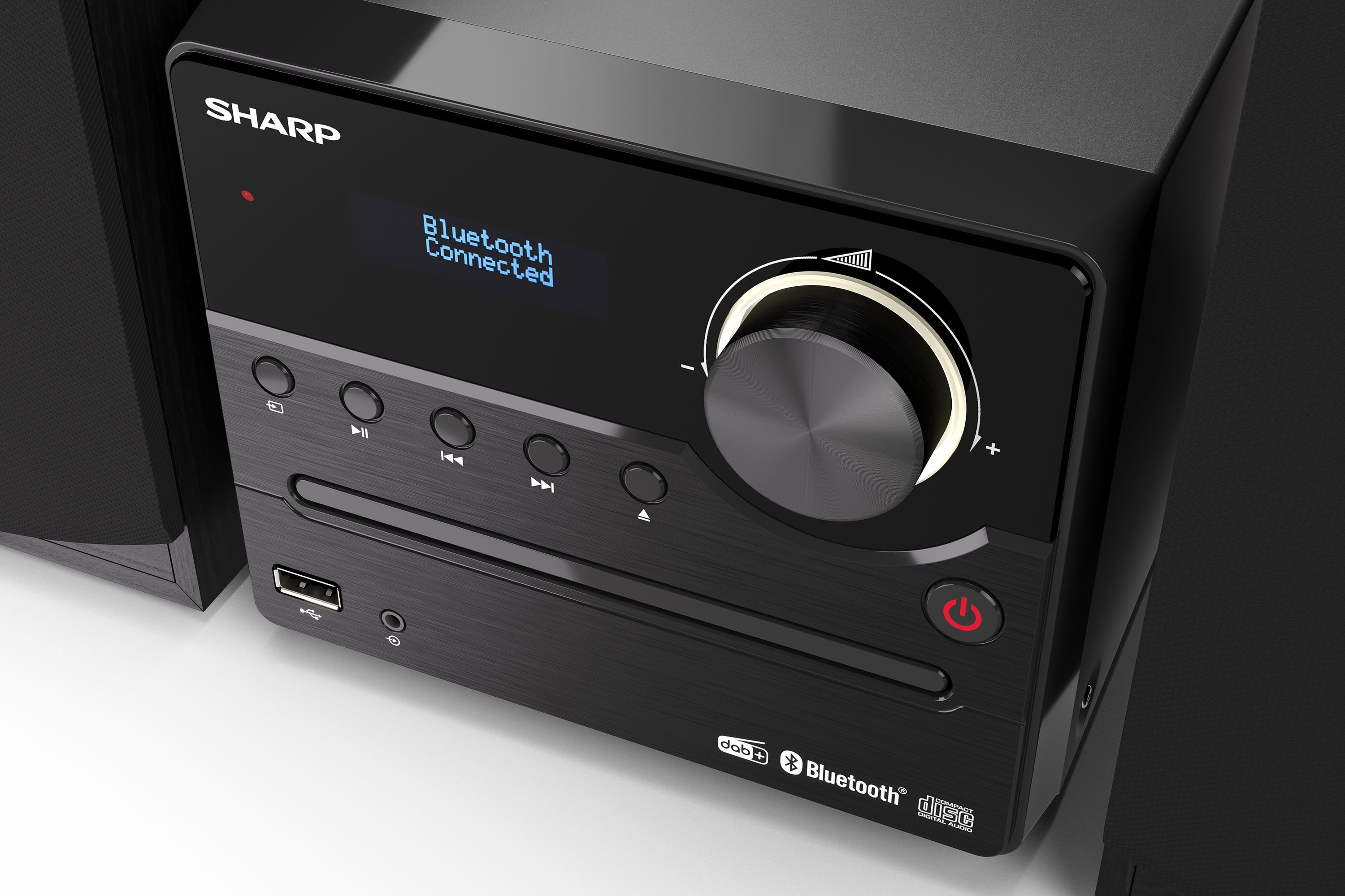 Ein schwarzer SHARP-CD-Player mit Lautsprechern und Bluetooth-Verbindung.