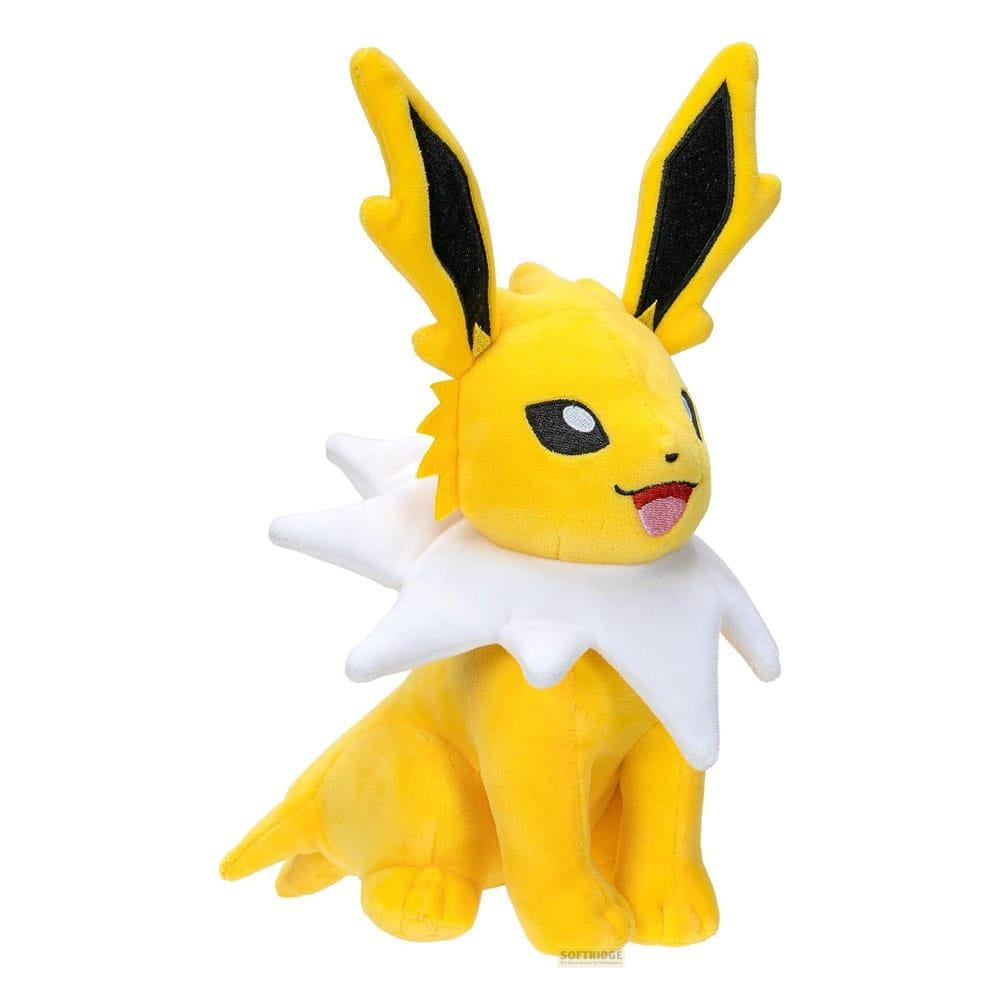 Ein gelber Pokémon-Plüsch mit schwarzen Ohren und weißem Kragen sitzt.