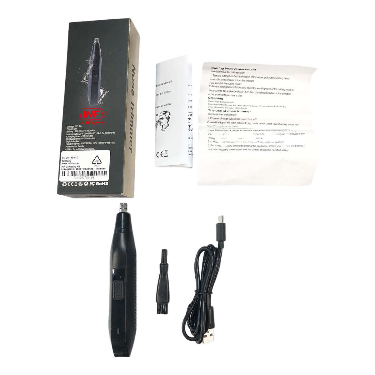 Ein schwarzer Nasentrimmer mit Ladekabel und Bürste liegt neben der Verpackung und Anleitung.