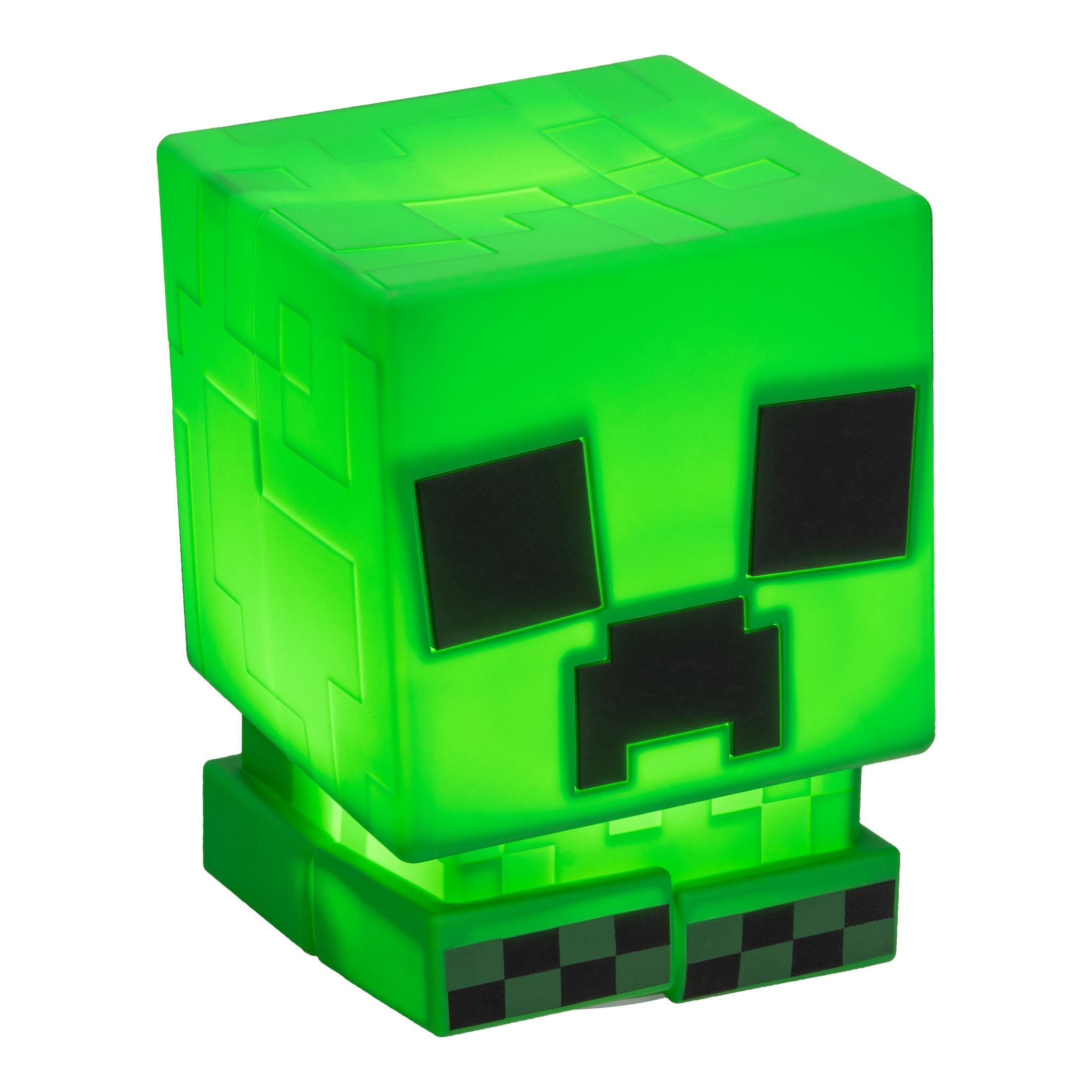 Świecąca zielona kostka Minecraft Creeper z czarnymi rysami twarzy.