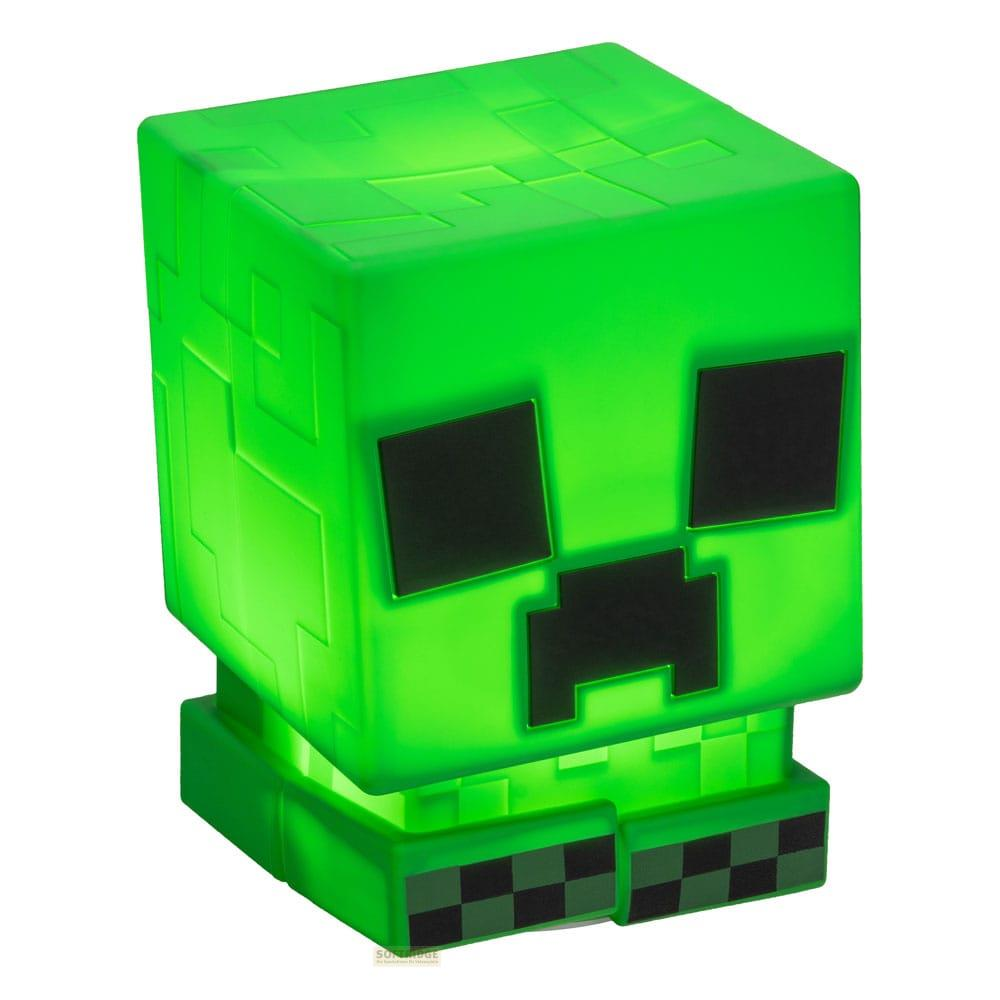 Zielona lampa Minecraft Creeper z czarnymi rysami twarzy.