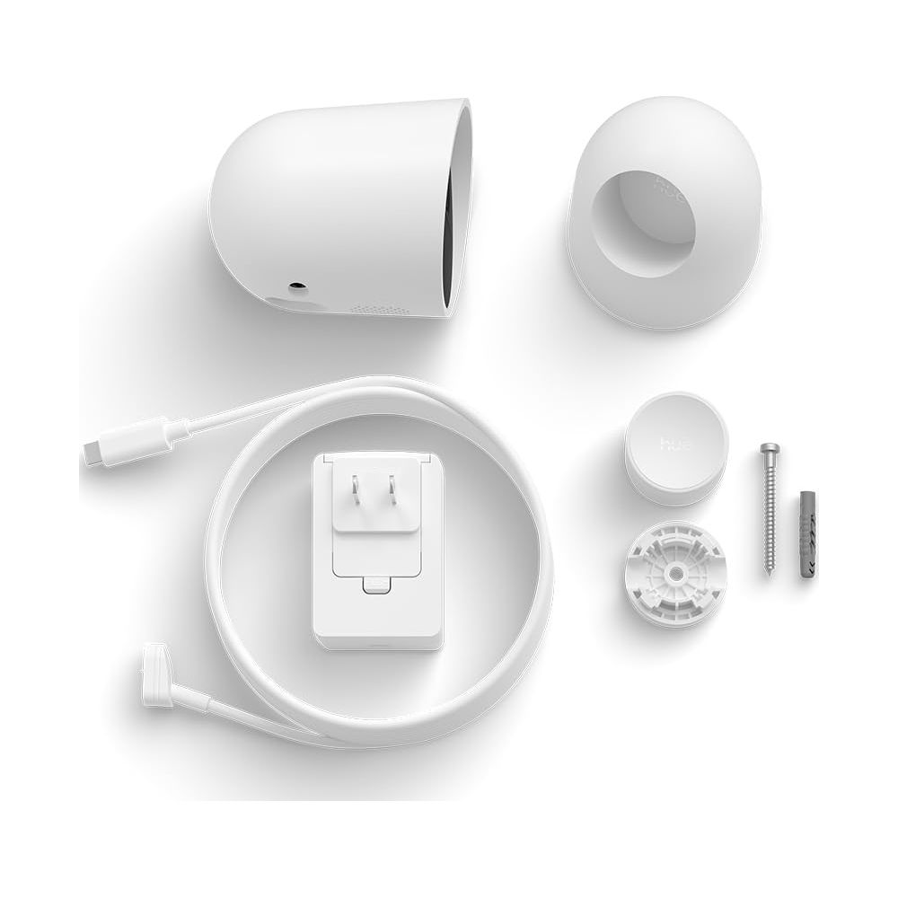 Weiße Kamera, Netzteil, Kabel, Halterung, Hue Bridge, Schraube und Dübel.