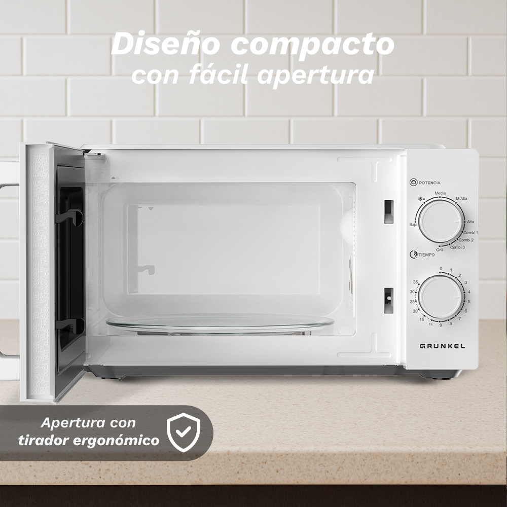 Un microondas Grunkel blanco con la puerta abierta y plato de cristal.