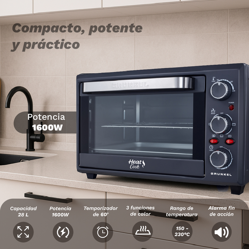 Horno de sobremesa gris oscuro con asa y controles plateados. Encimera de cocina.