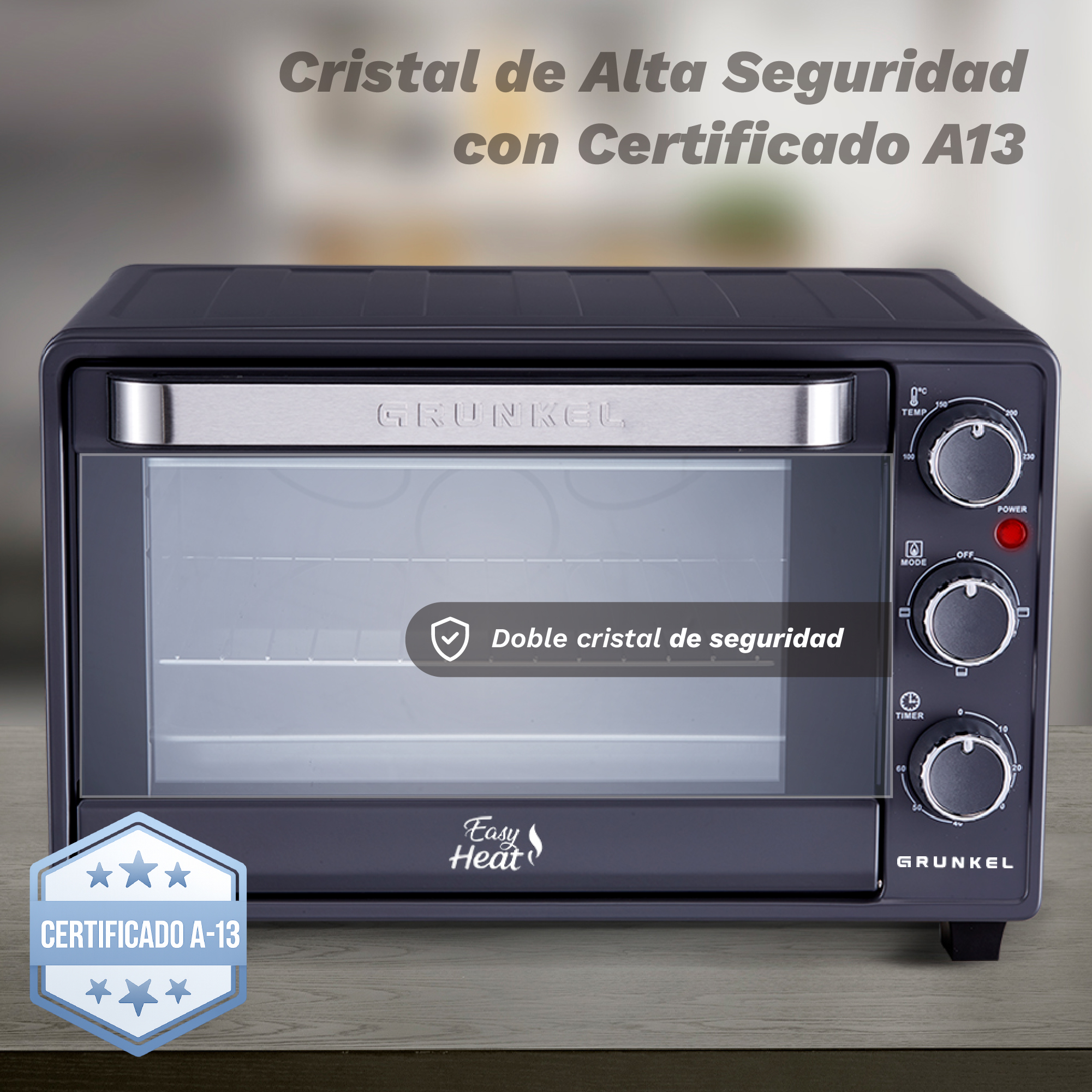 Horno de sobremesa gris oscuro con controles plateados y puerta de cristal.