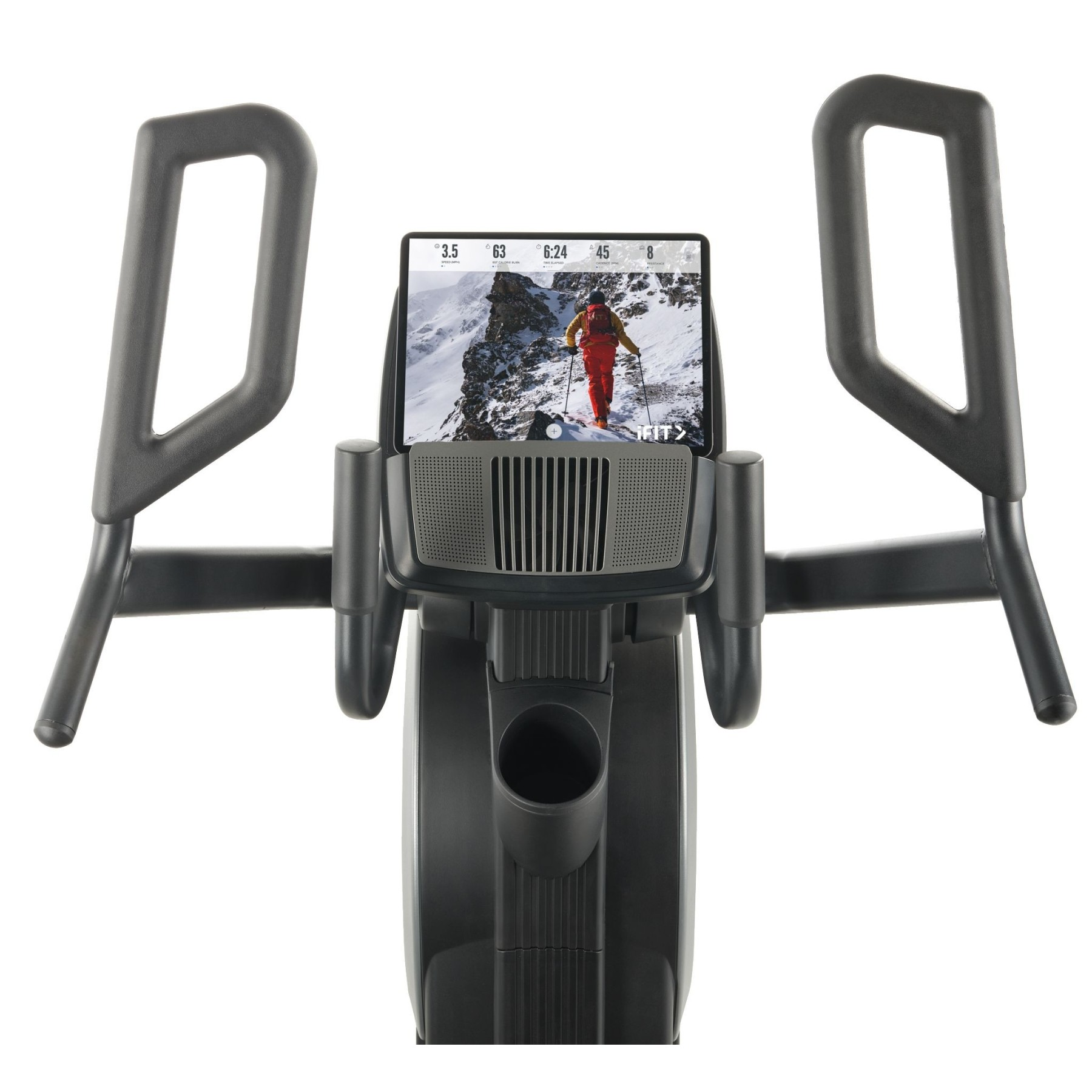 Ein Mann in roter Kleidung geht in den Bergen Ski. Ergometer im Vordergrund.