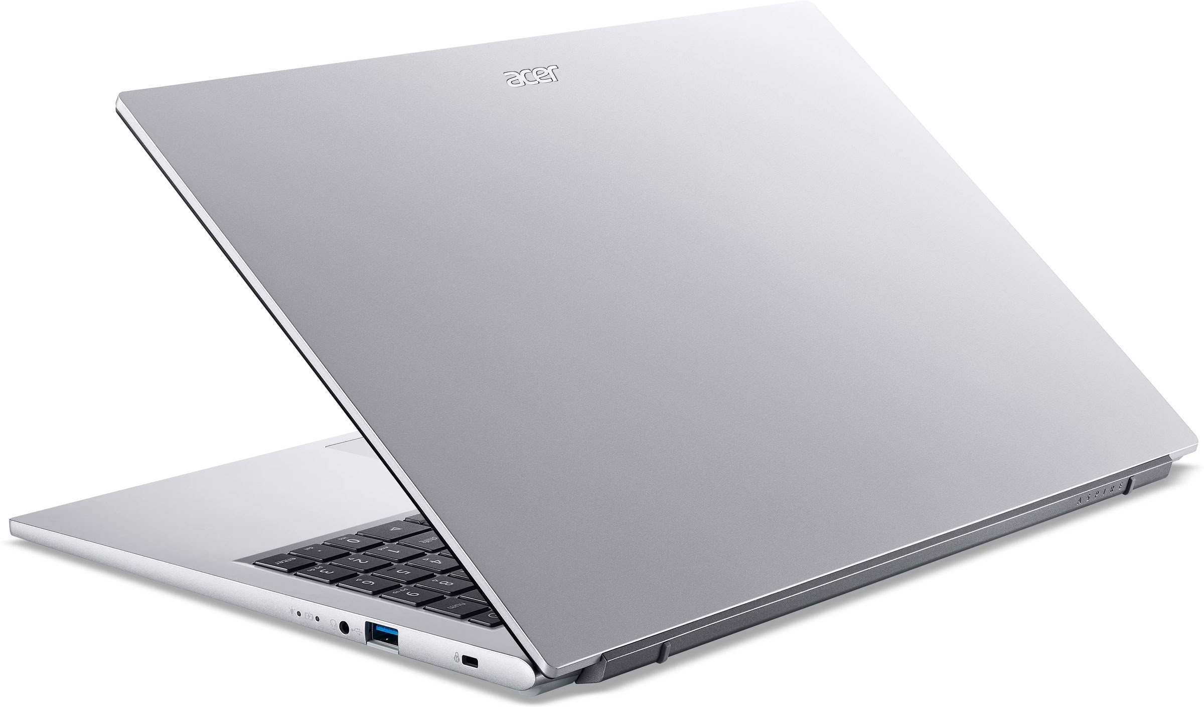 Un portátil Acer plateado está abierto, mostrando el teclado y los puertos.