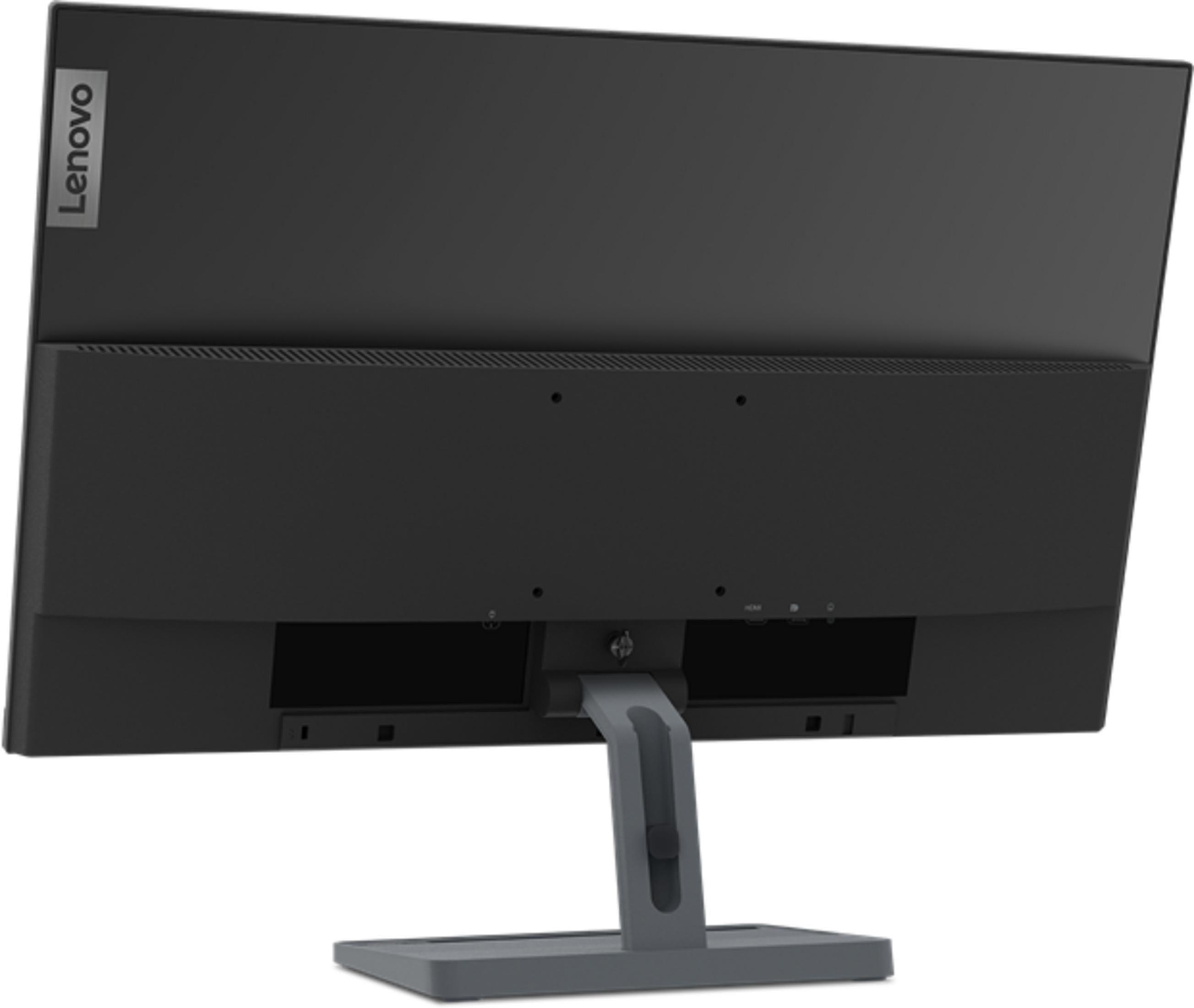 Vista trasera de un monitor Lenovo negro con logo plateado sobre soporte gris.