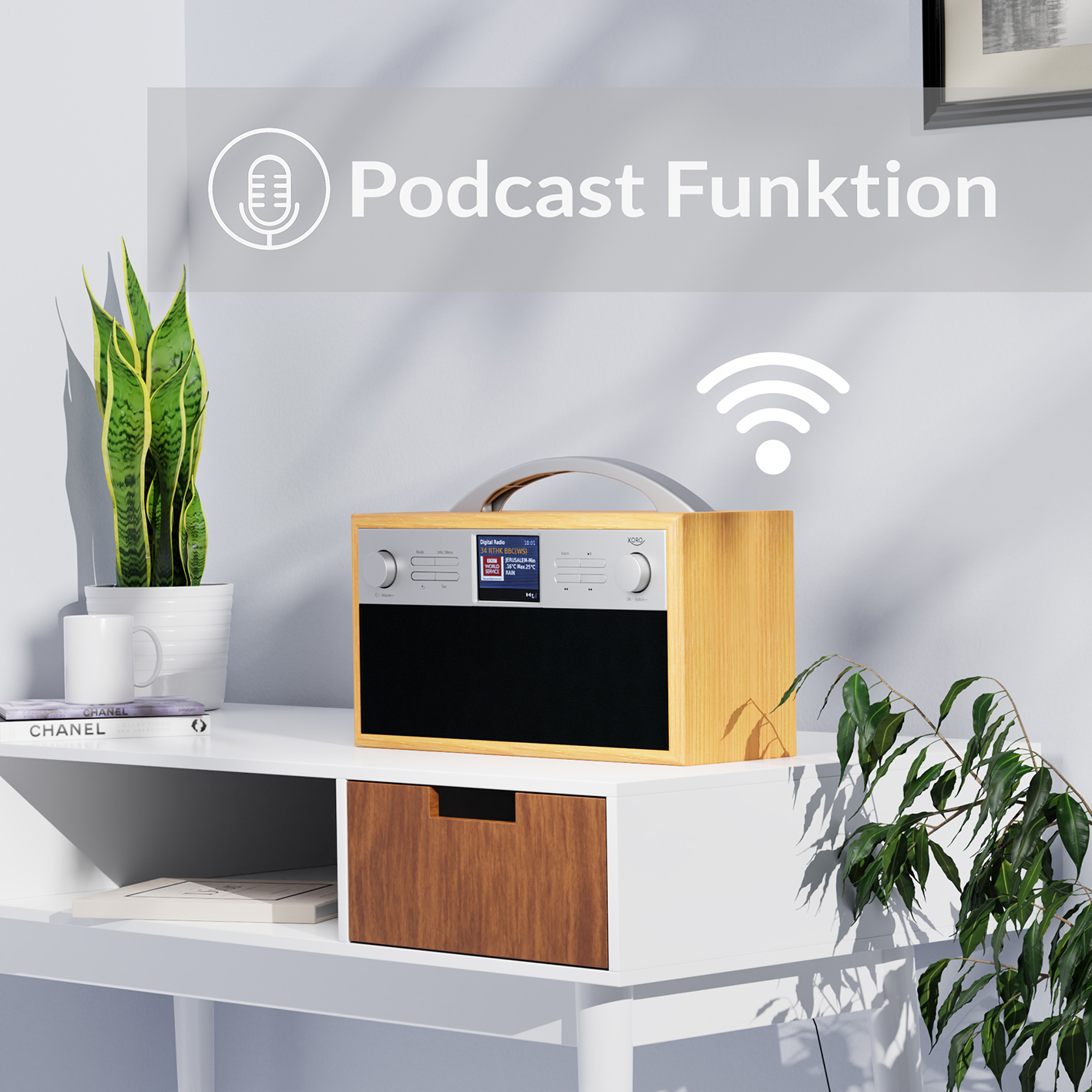 Ein Holzradio mit Bildschirm und Griff steht auf einem weißen Tisch. Links eine Pflanze.