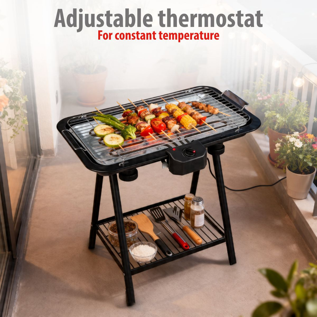 Electric grill with skewers and vegetables on a balcony.