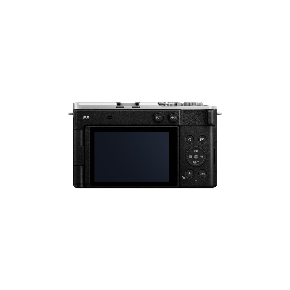 Back view of a black digital camera with a silver top and screen.