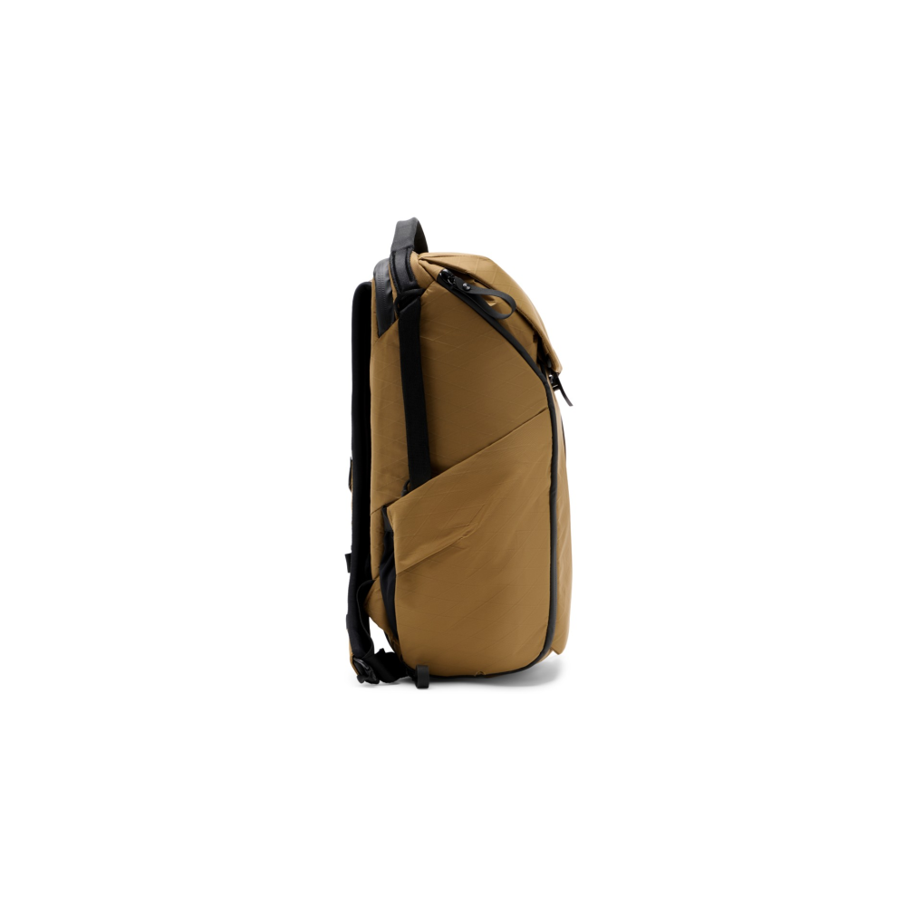 A brown backpack with black straps and zipper, shown from the side.