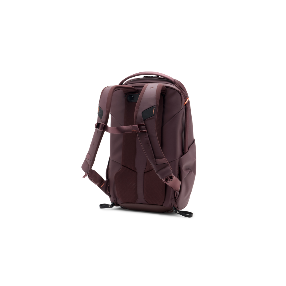 Back view of a maroon backpack with padded straps and orange accents on a white background.