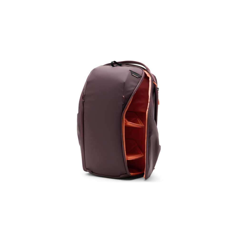 A burgundy backpack with an open compartment and orange dividers.