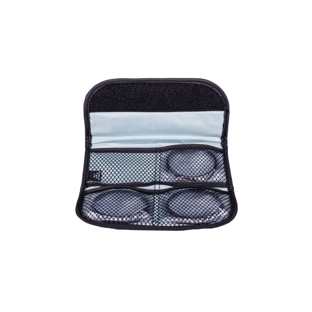 A black case holding four gray, round objects, two at the top and two at the bottom.