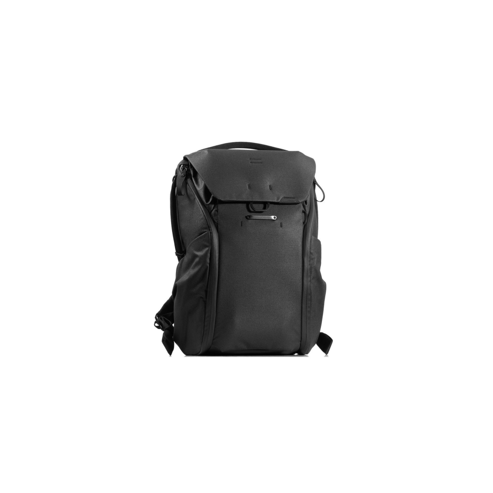 A black backpack with a flap closure stands against a white background.