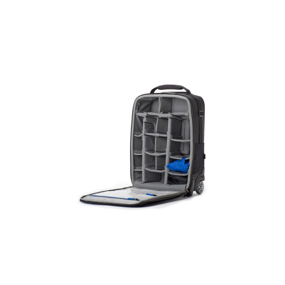A gray rolling suitcase with compartments, open with a blue pouch.