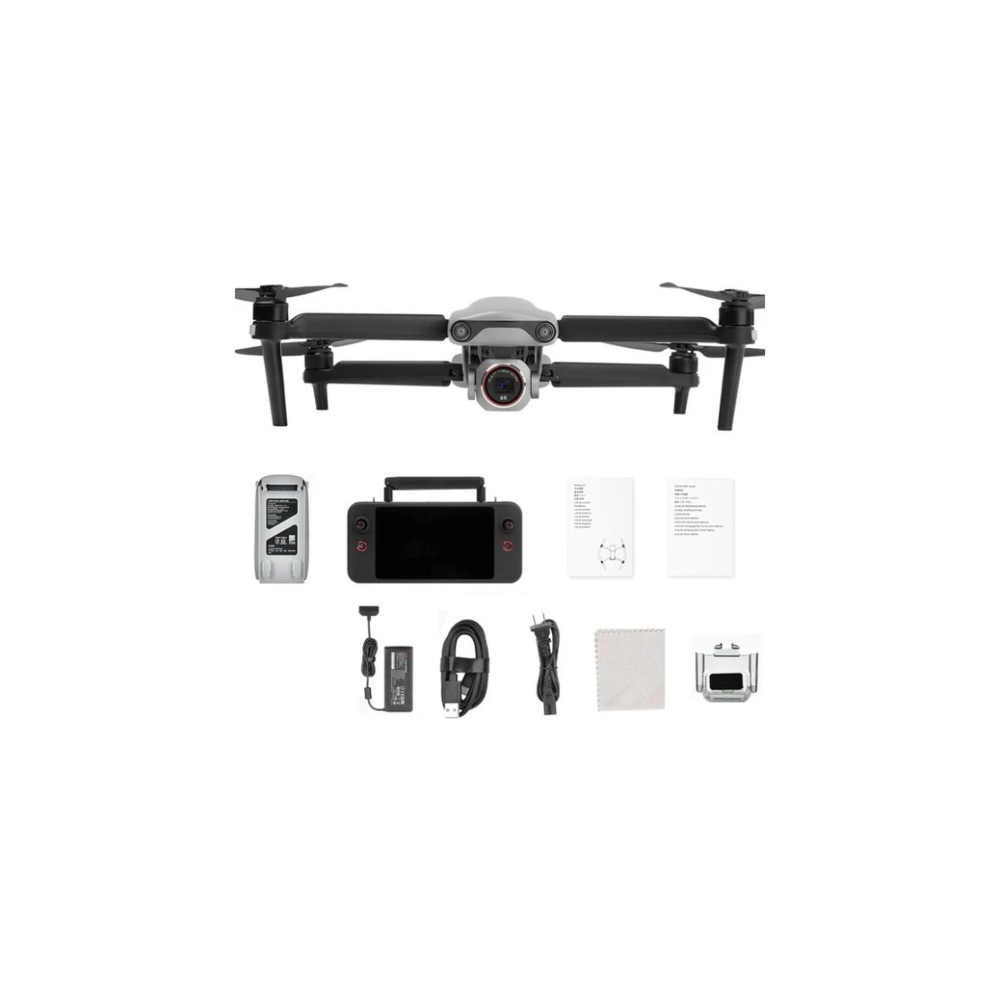 Een grijze en zwarte dronekit met afstandsbediening, batterij, kabels en instructies.