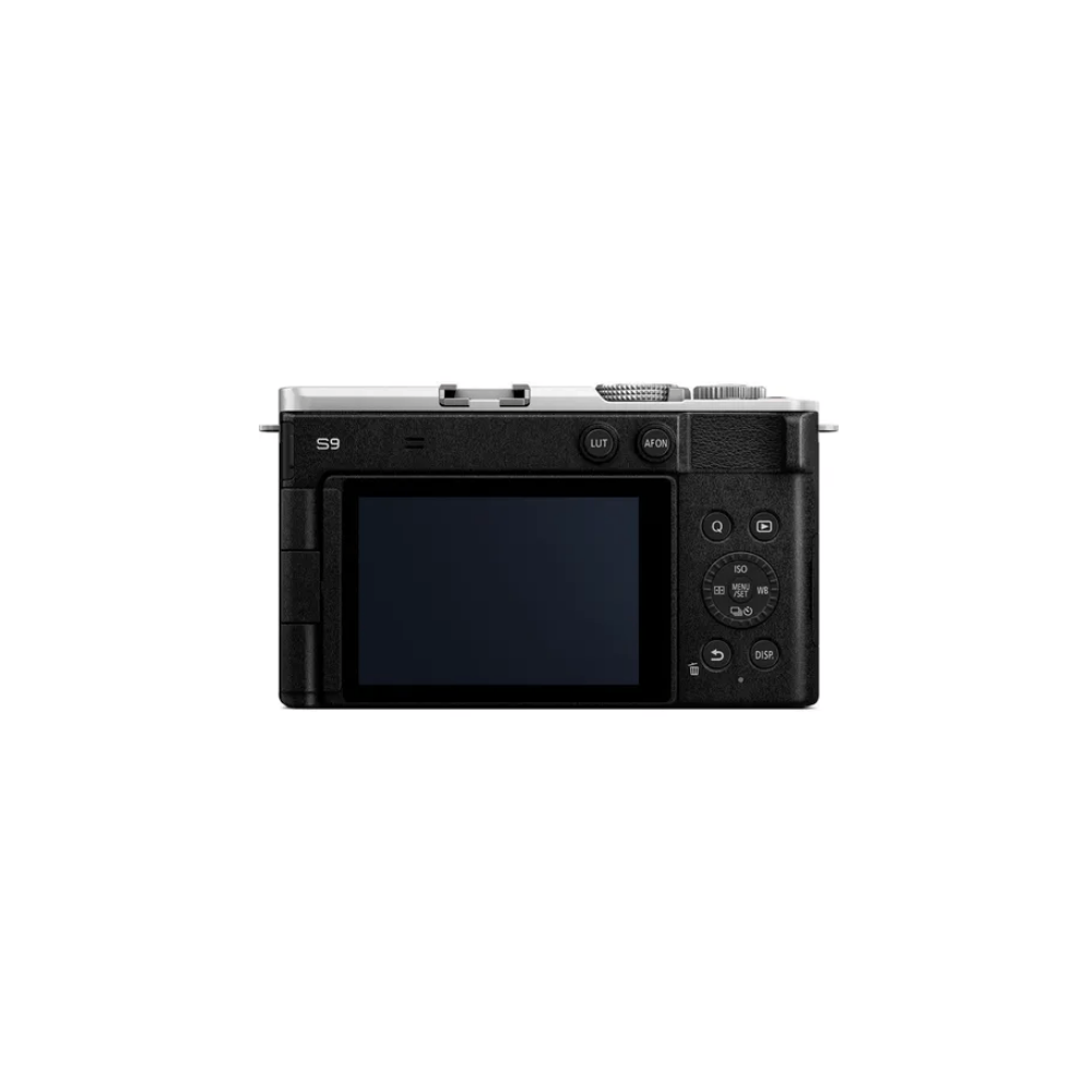Rear view of a black camera with a silver top and LCD screen.