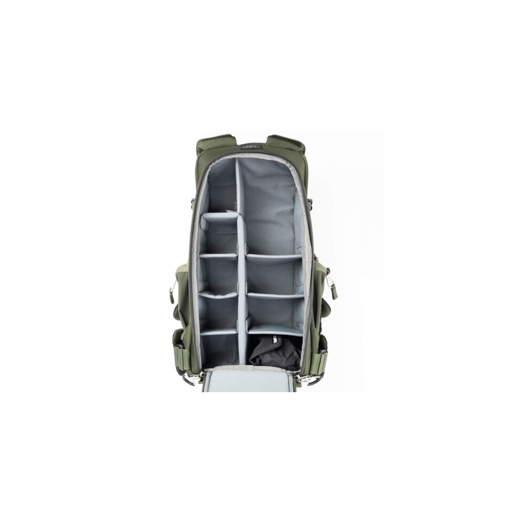 Green backpack with its main compartment open, showing grey dividers.