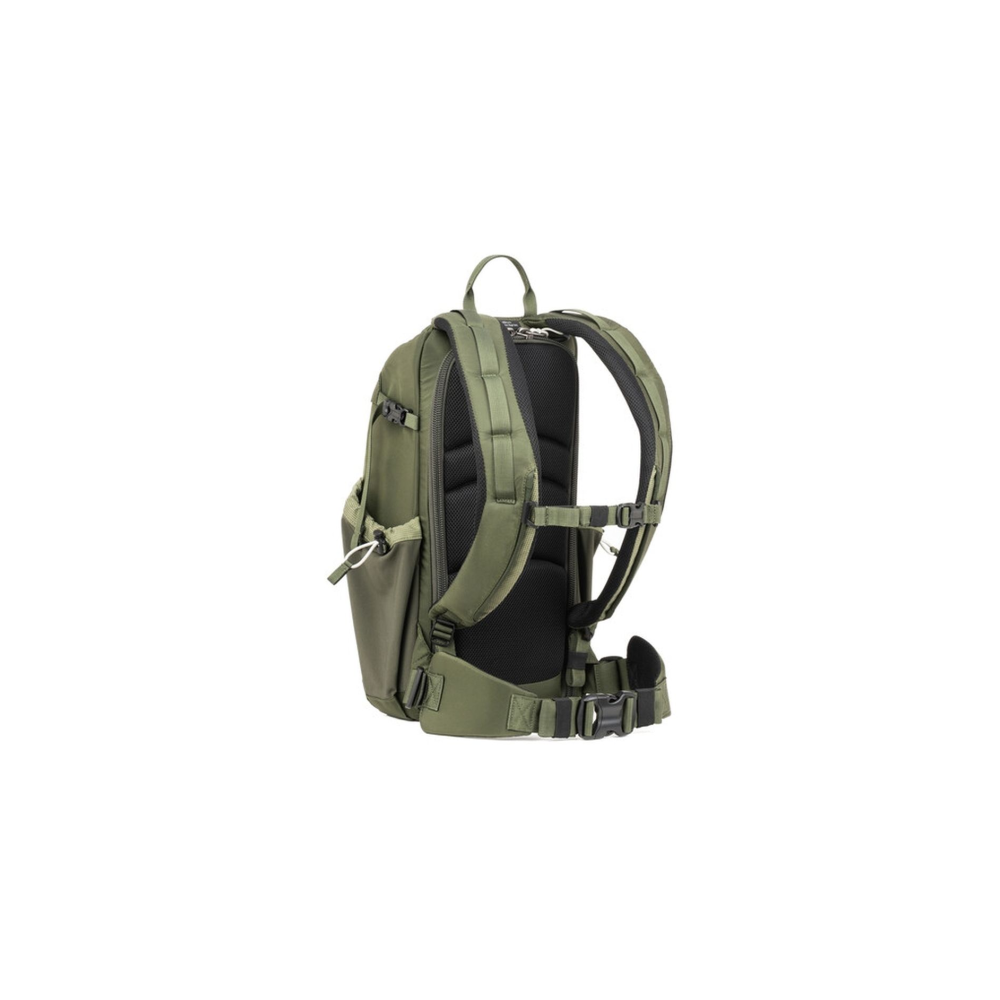 Back view of a green backpack with padded straps and hip belt.