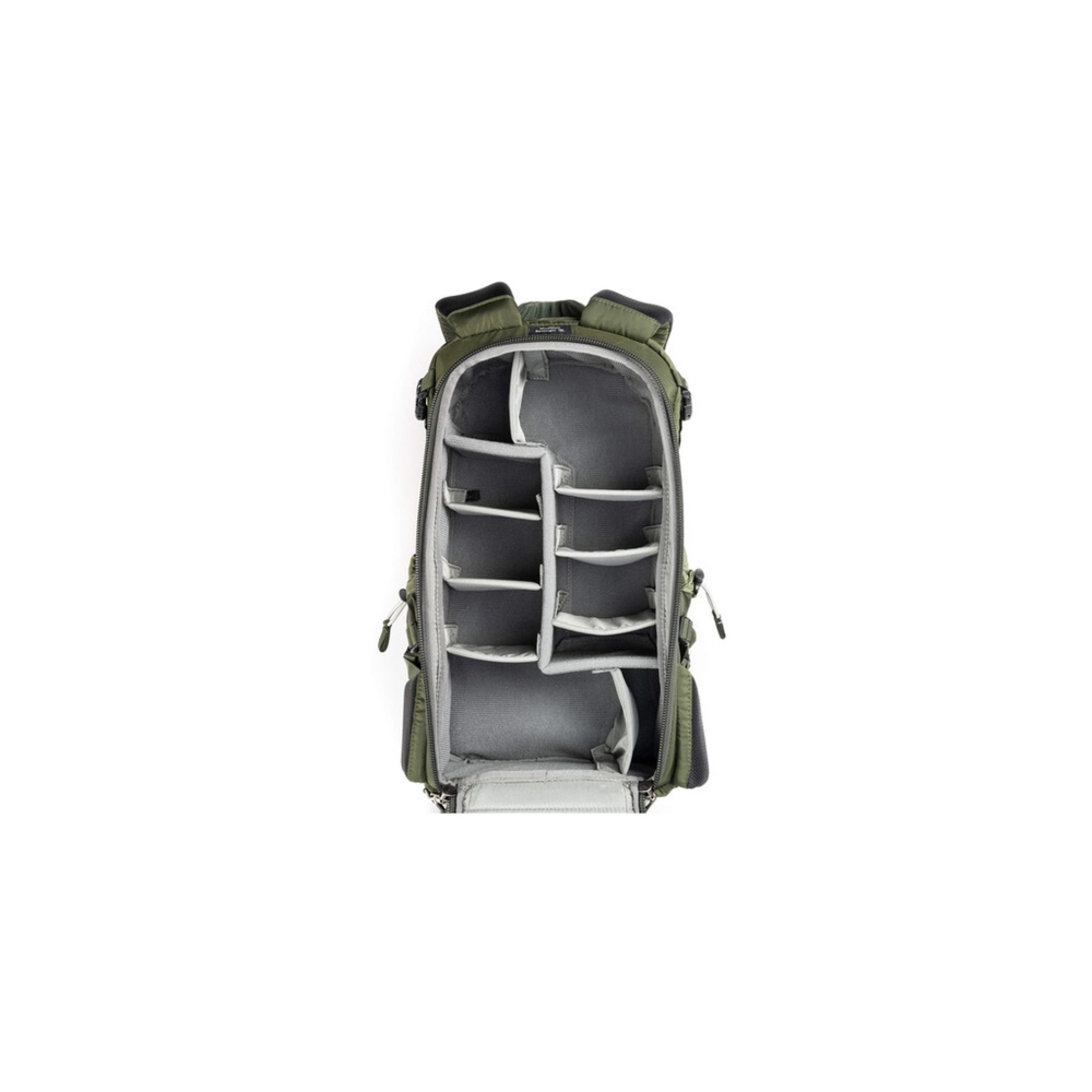 Green camera backpack with open compartment and many dividers.