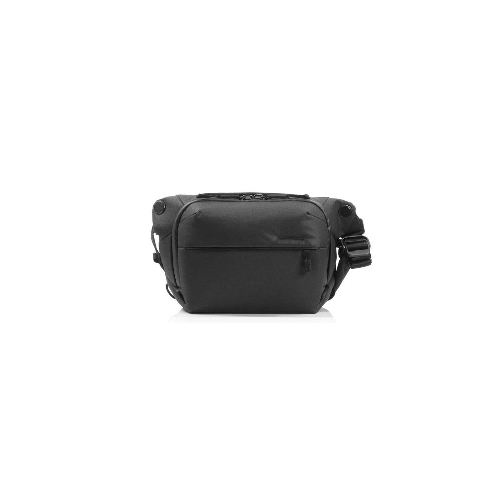 A black sling bag with zippers and a buckle strap.