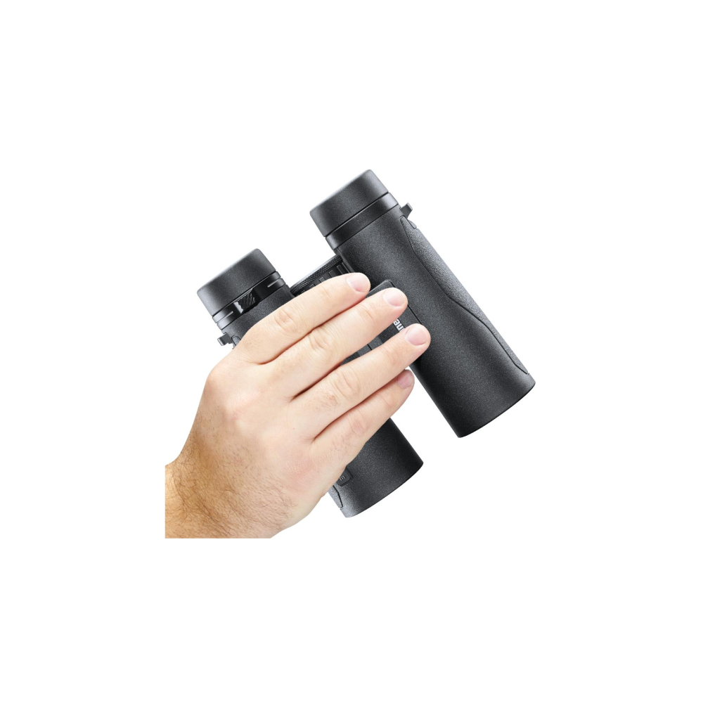 A hand holds black binoculars with a white background.
