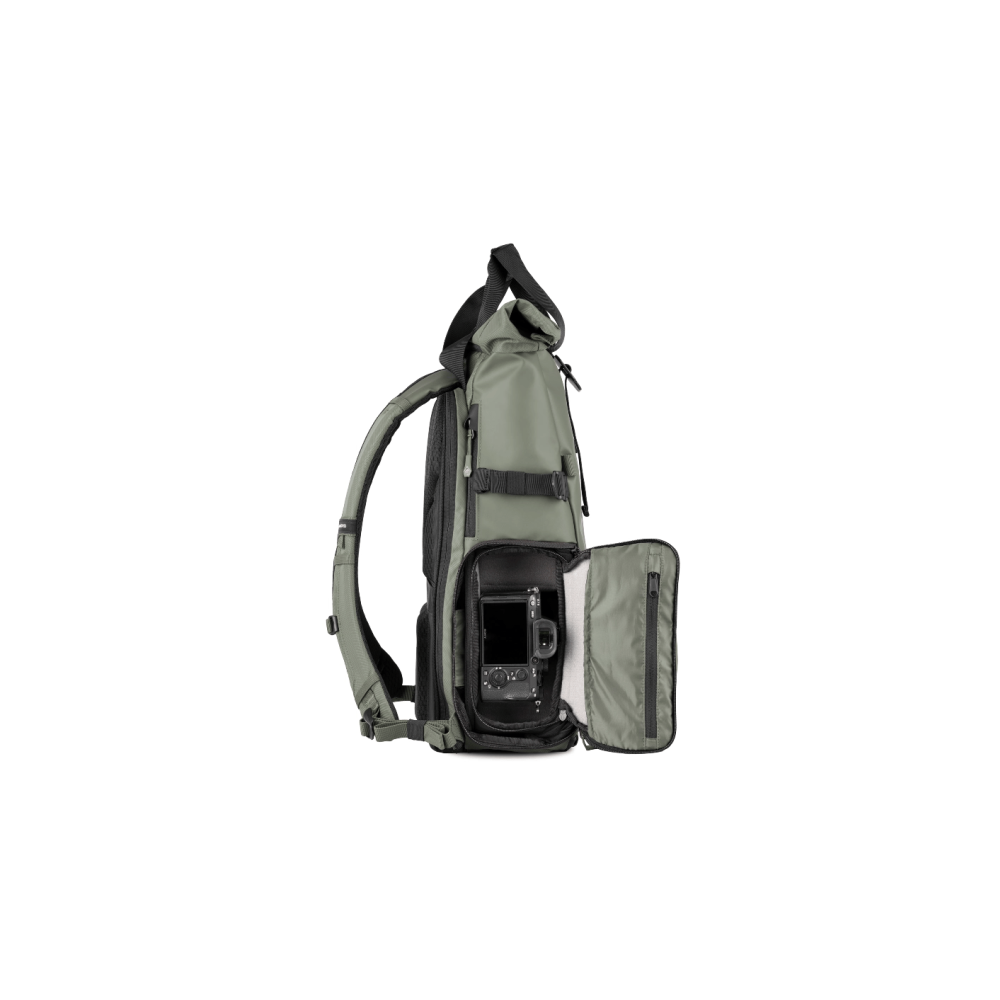 A green backpack with an open compartment revealing a camera inside.