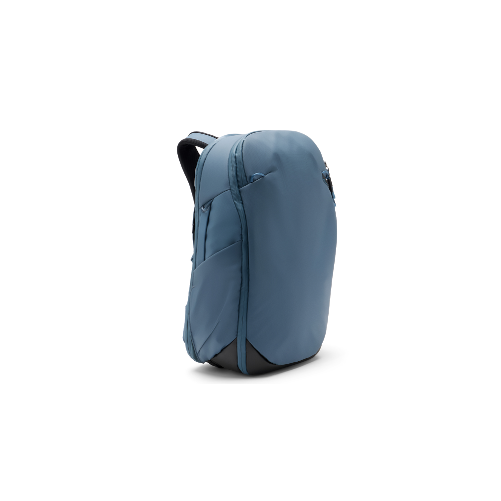 A blue backpack with black straps on a white background.
