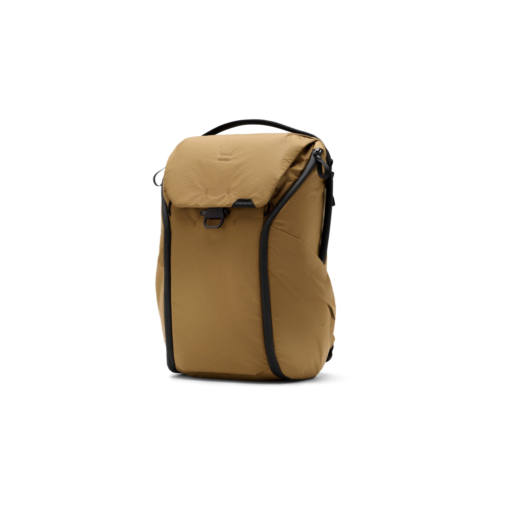 A brown backpack with black zippers and handle, isolated on white.