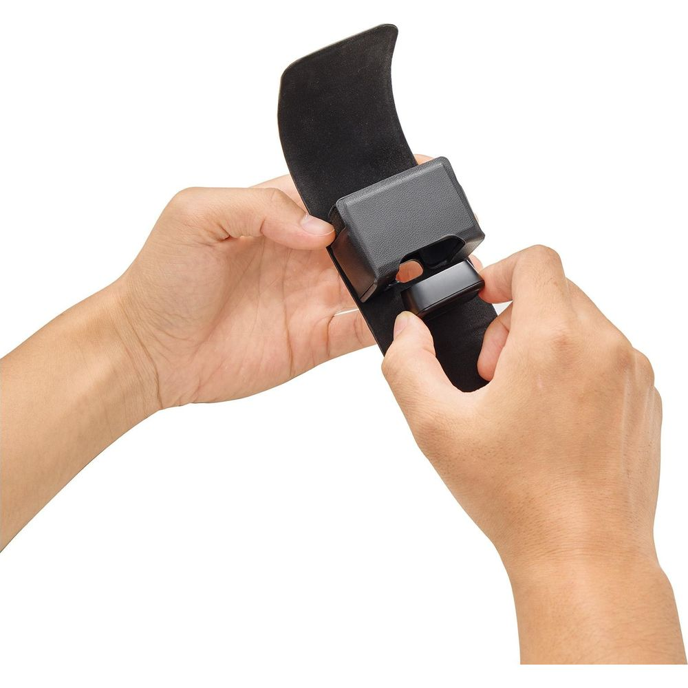 Two hands adjust a black plastic component on a black fabric strap. White background.