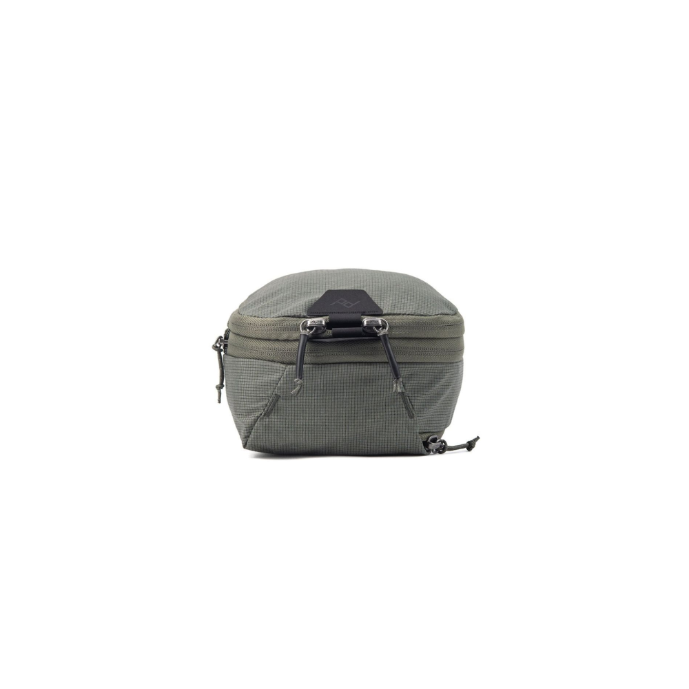 A green textured pouch with two zippers and black cords is shown against a white background.