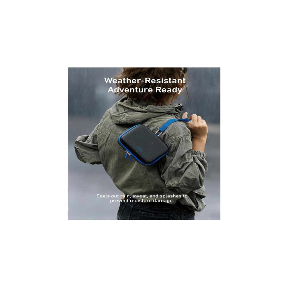 A person carries a bag over their shoulder in the rain. Weather-resistant.