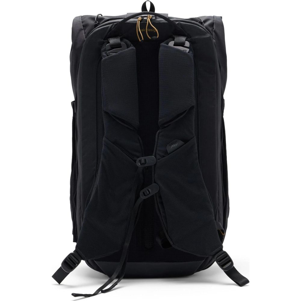 Black backpack with padded straps and buckles. Features a drawstring closure at the top.