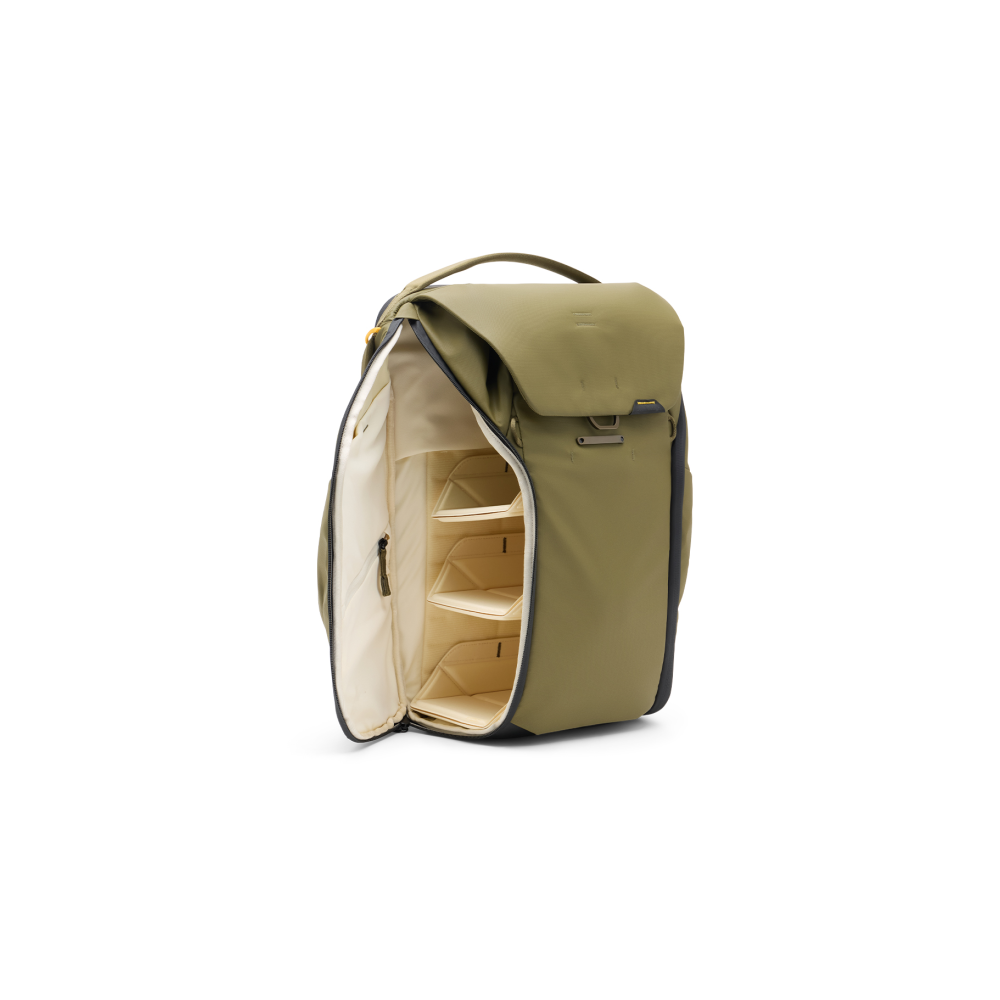 An olive green backpack with its front open, showing three compartments.