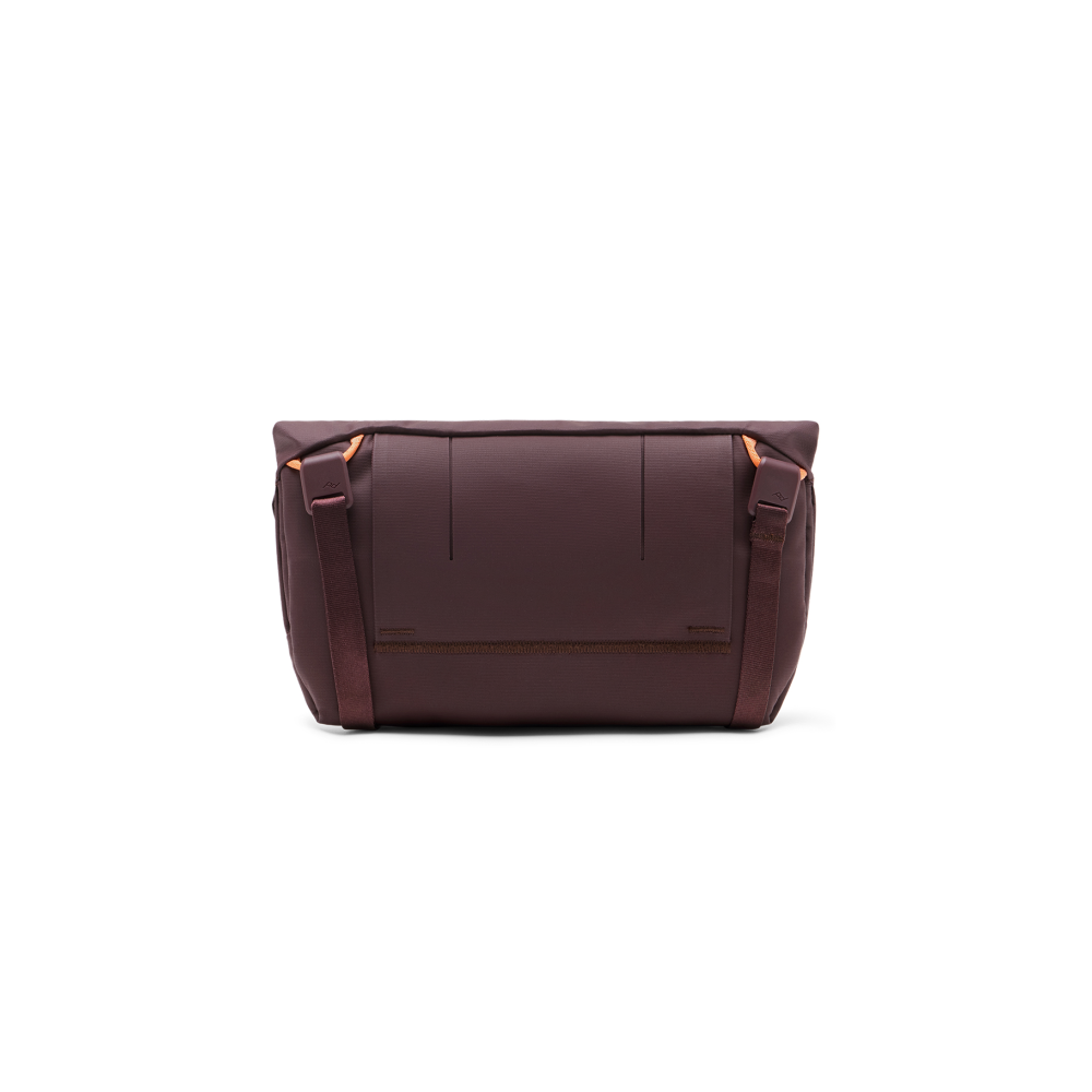 A burgundy messenger bag with orange accents and an adjustable strap.