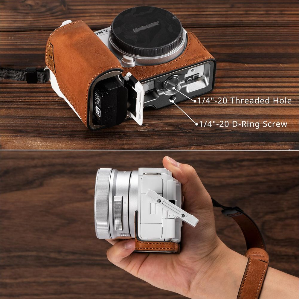 A brown leather case for a Sony camera with its battery compartment open.
