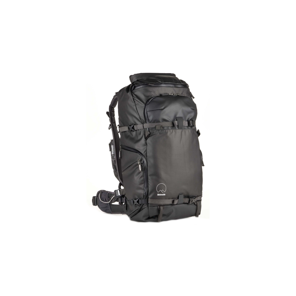 A black backpack with many straps and zippers, isolated on a white background.