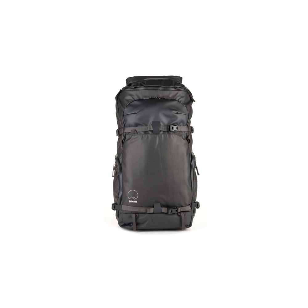 Black backpack with buckles and Shimoda logo on a white background.