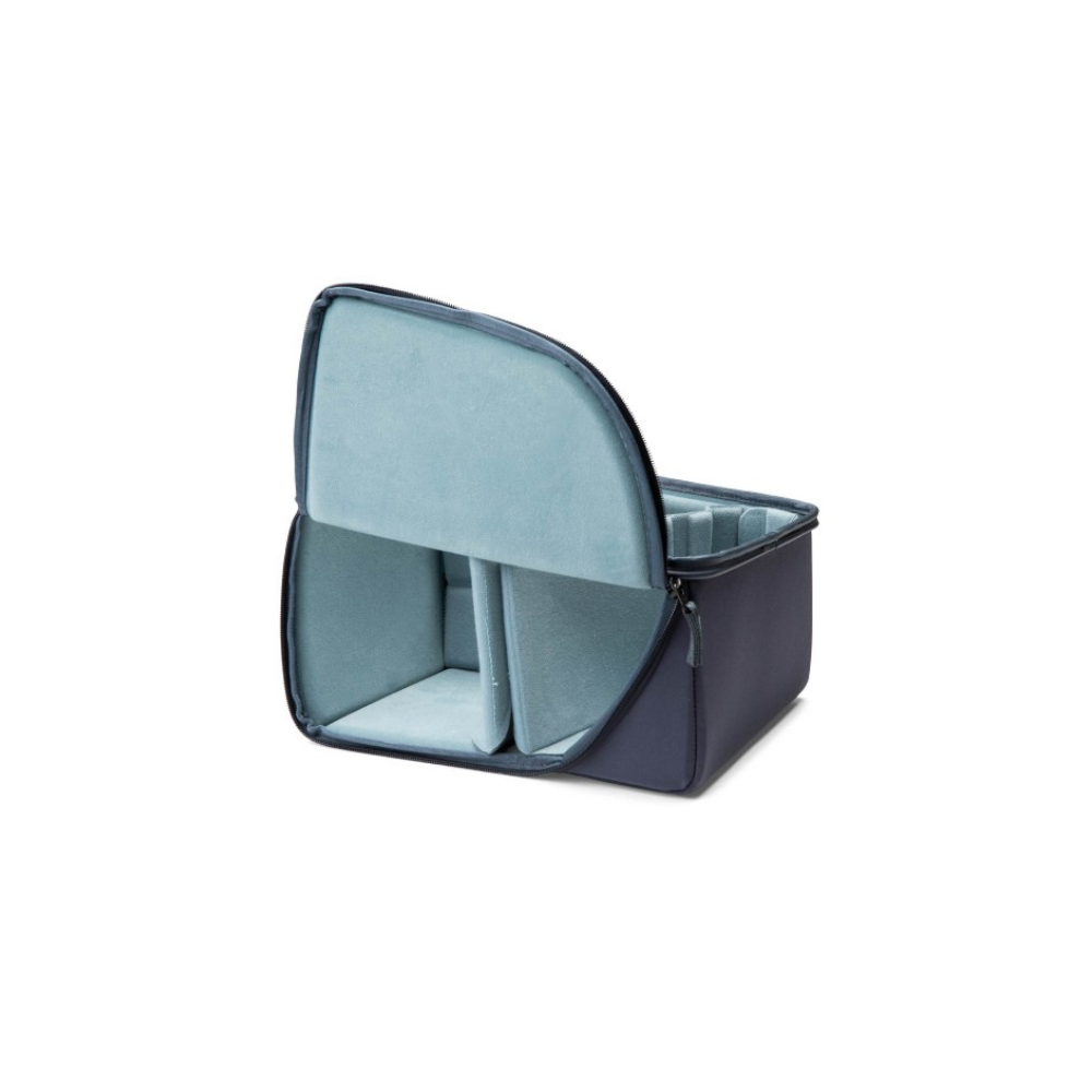 A dark gray camera bag with a light blue interior and dividers, open.