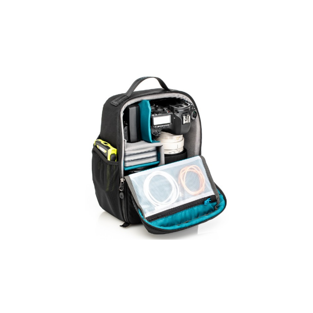 Black camera backpack with open compartment, containing a camera, lens, and cables.