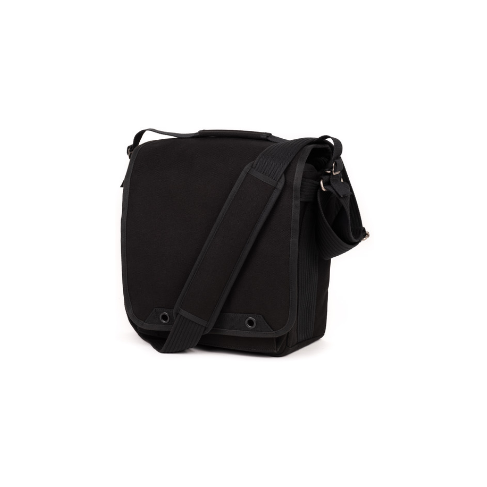 A black messenger bag with a strap rests against a white background.
