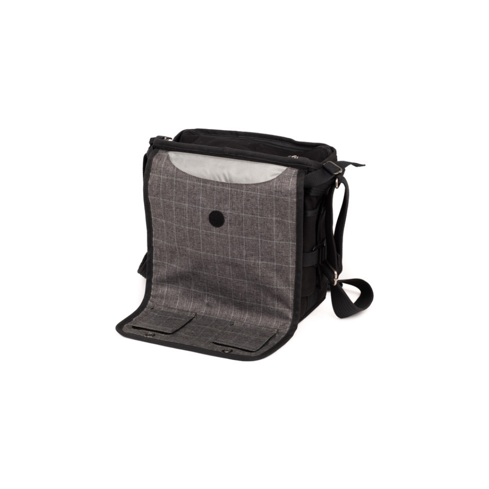 A black messenger bag with a grey plaid flap that is open.