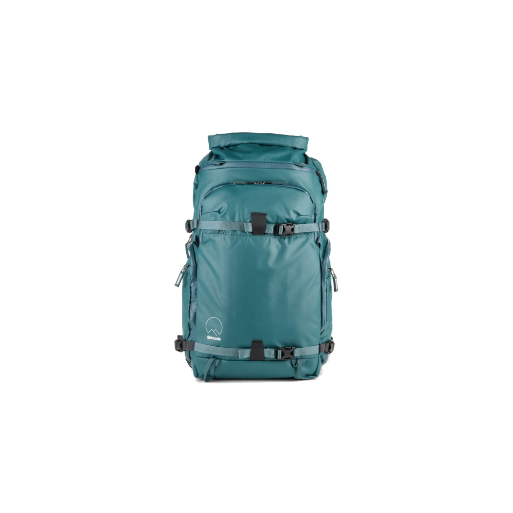A teal backpack with multiple straps and buckles, set against a white background.