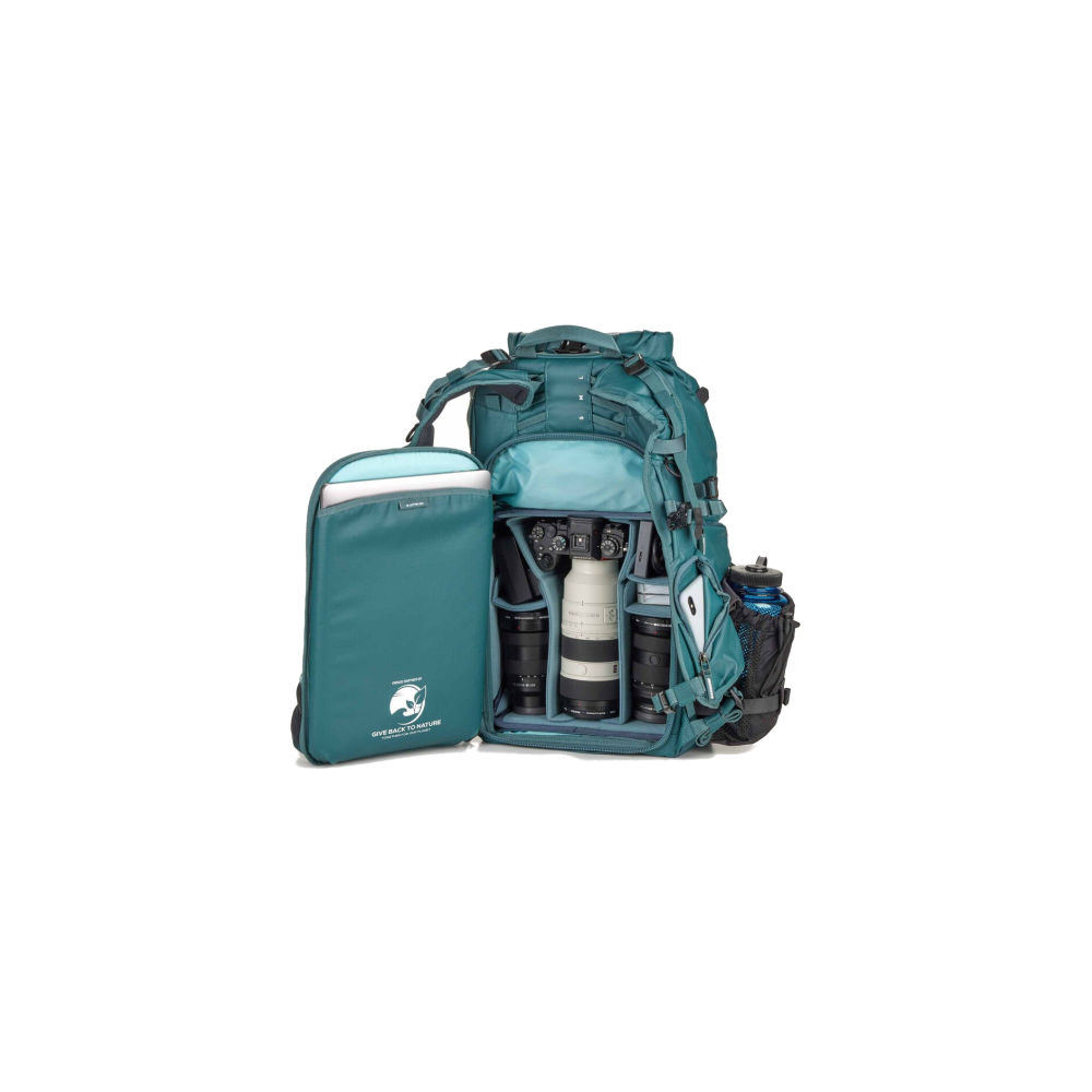 A teal backpack with an open compartment, showing a camera and lenses.