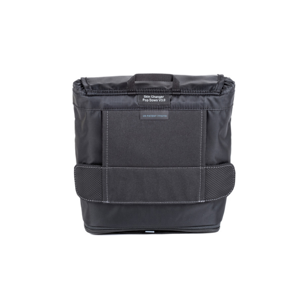 Black camera bag with handle, on a white background.