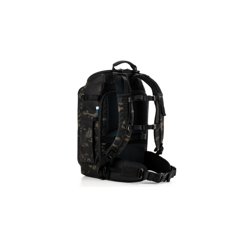 A tactical backpack with camouflage pattern, viewed from the back left.