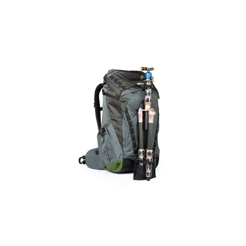 A gray backpack with green accents and an attached tripod.